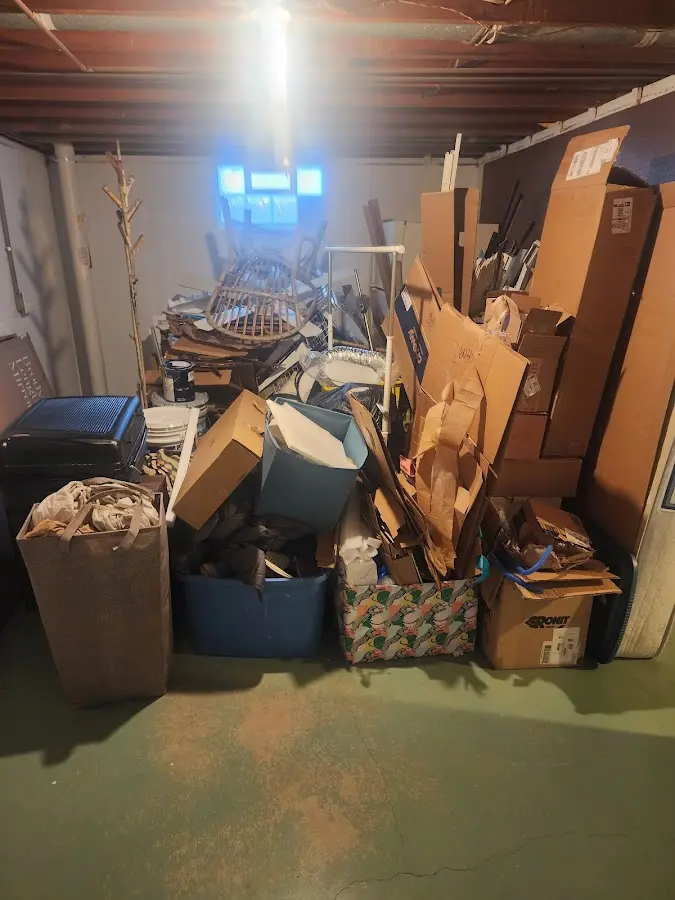 Roll-off dumpster container at job site for 2 Yard Dumpster Rental in Lake Jackson