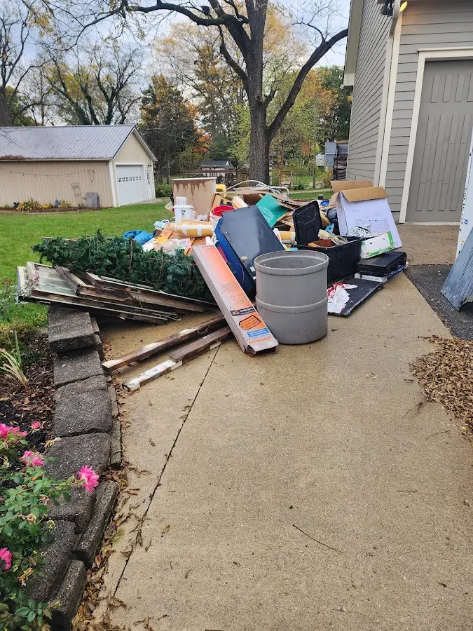 Dumpster being loaded with debris for 30 Yard Dumpster Rental in Lake Jackson